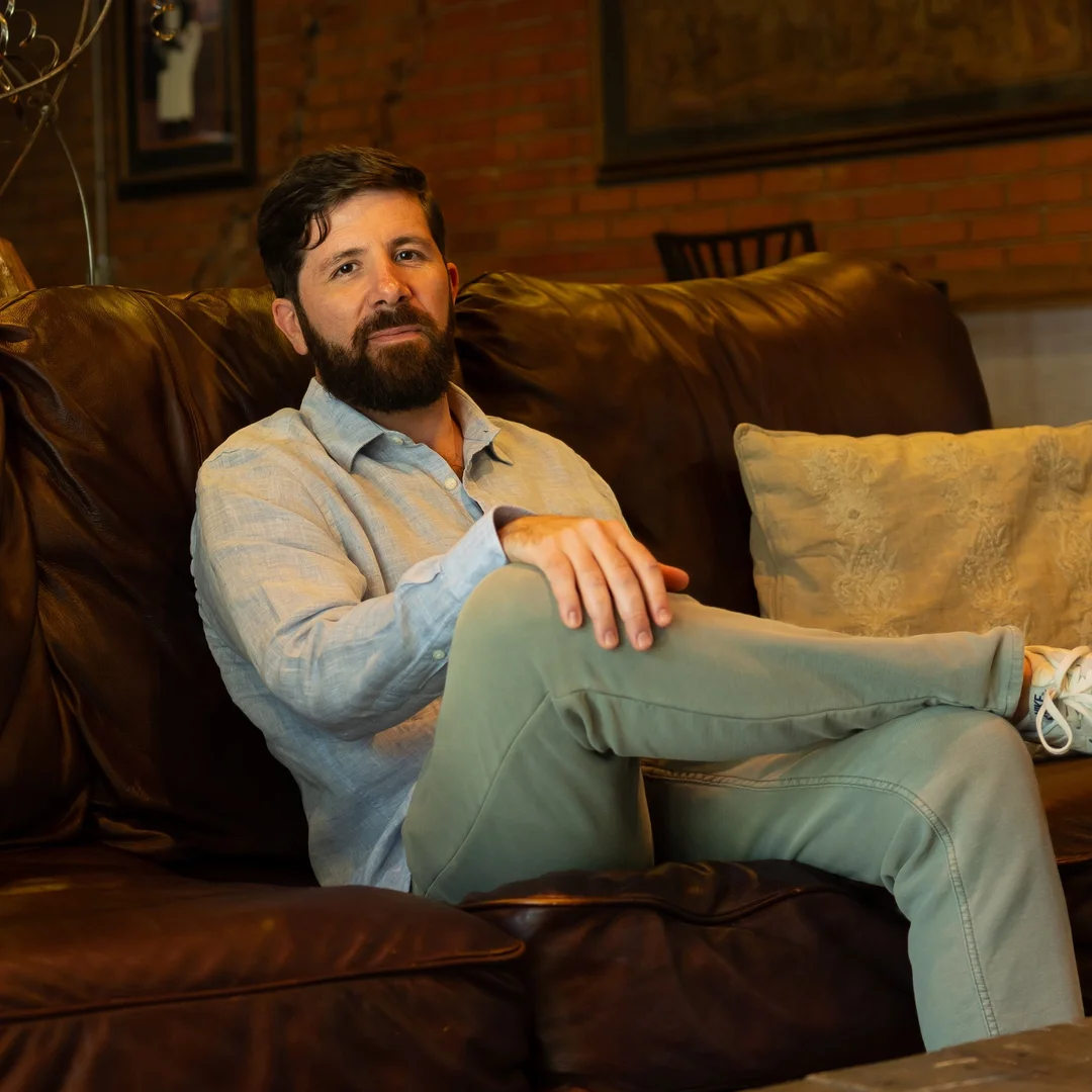 Ringba User Stories - Bill Somerville Sitting on Leather Couch